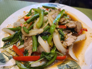 Savory Asian Stir-Fry with Vegetables and Meat on White Plate