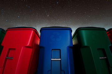 Vibrant Recycling Bins Against a Mesmerizing Starlit Night Sky
