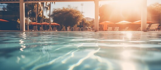 Blurred background of an outdoor swimming pool - obrazy, fototapety, plakaty