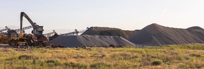 Heavy equipment works at a sand processing quarry