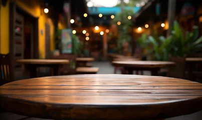Foto op Canvas Acercamiento a una mesa rústica de madera vacía en un hermoso restaurante mexicano © adanzat