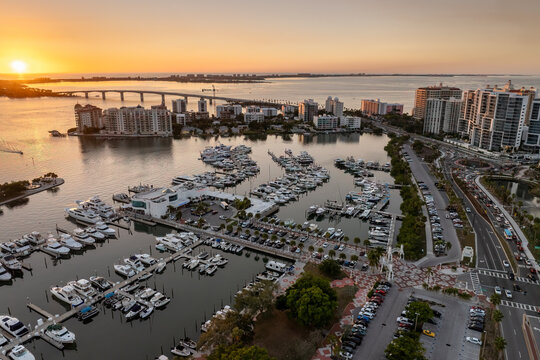 Sarasota, Florida city downtown at sunset with expensive bayfront high-rise buildings. Urban travel destination in the USA