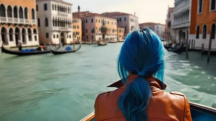 Foto op Plexiglas Rear view of a woman in a gondola in Venice's canals. Vacation in Italy © Gaston