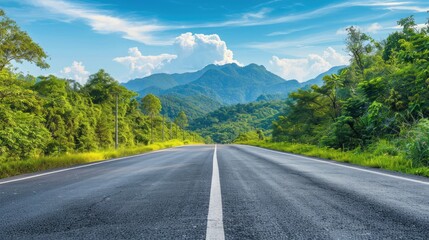 
Asphalt highway road and green forest with mountain natural landscape under blue sky, nature background