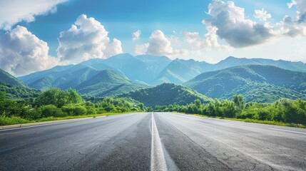 
Asphalt highway road and green forest with mountain natural landscape under blue sky, nature background