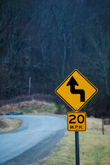 Slow for S-curve Ahead sign