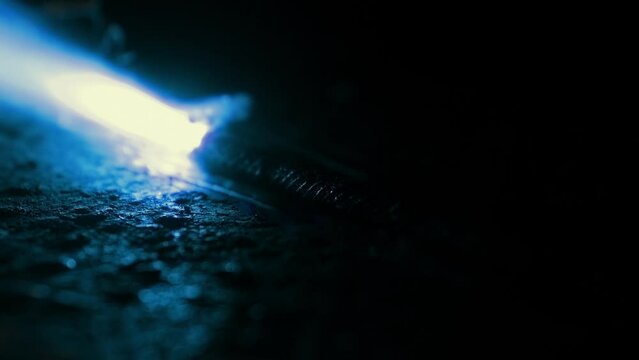 An Industrial Fuse Burns Past Closeup In The Dark