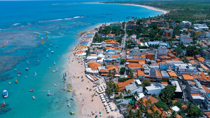 Fototapeta premium Porto de Galinhas. Beach. Brazil. The warm and crystal-clear waters of Porto de Galinhas make snorkeling a popular sport because of the amazing variety of fish that can be seen every day.