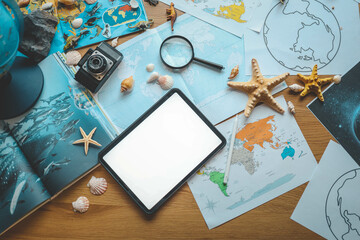 Tablet with isolated screen in child's hands, studying geography concept