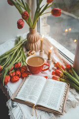 Open bible in home morning interior