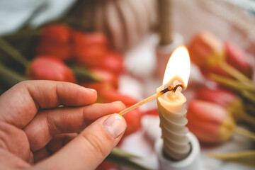 Girl lights a candle, spring aesthetics