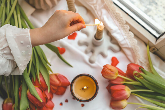 Girl lights a candle, spring aesthetics