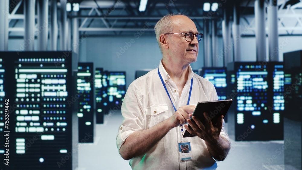 Poster happy computer scientist expertly managing data while navigating through industrial blade servers. c