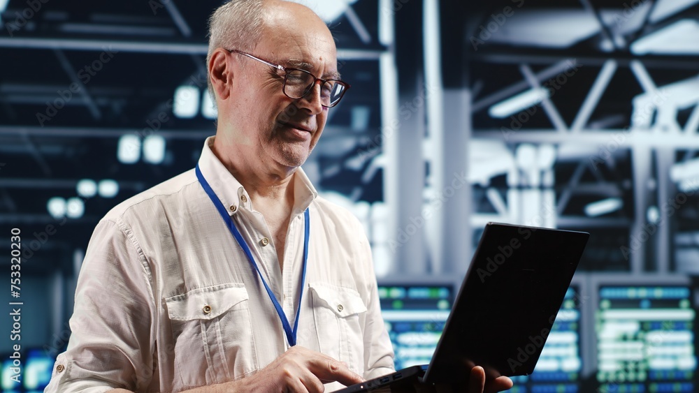 Aufkleber organized professional navigating network of server equipment in industrial hub. serviceman with lap