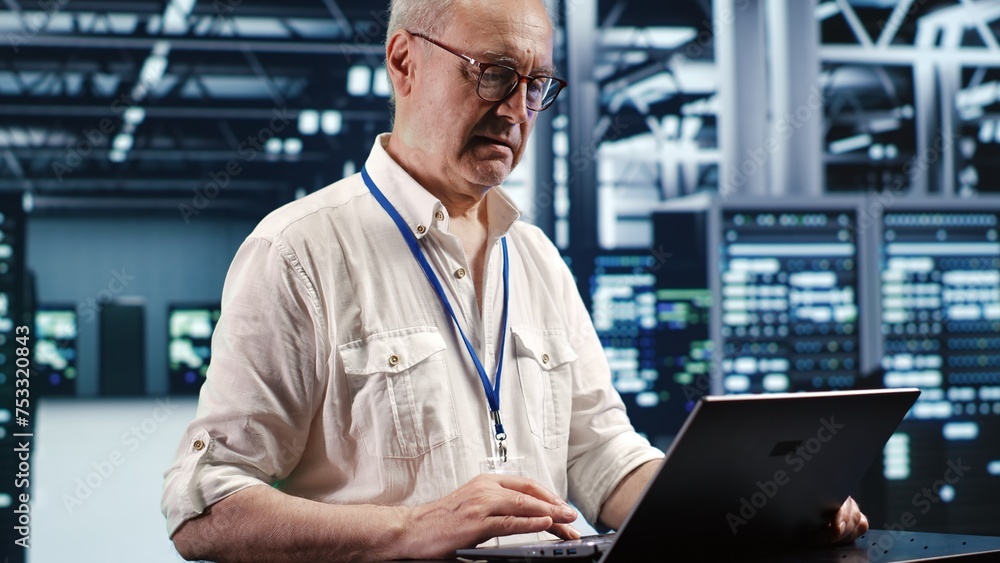 Poster trained engineer expertly managing data while navigating in industrial server room. specialist ensur
