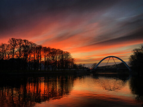 Sunset over the river Emaj&otilde;gi and Vabaduse sild bridge in Tartu, Tartumaa, Estonia, April 2019