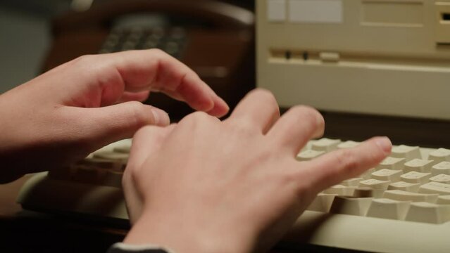Woman writing on keyboard retro pc close-up , Old computer studio close-up, Desktop vintage retro wave display, late 90s PC.