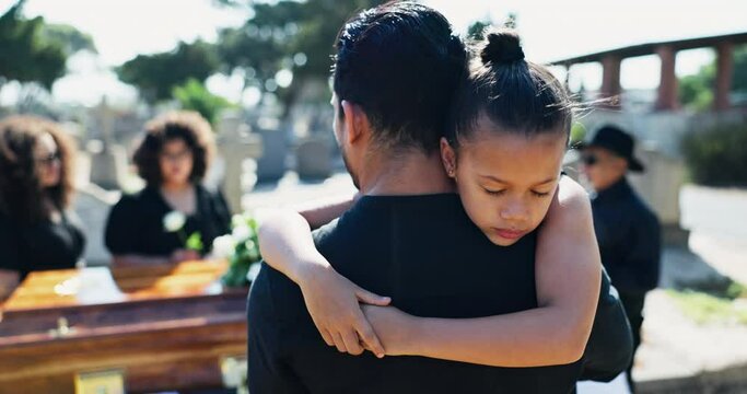 Child, hug or father in graveyard for funeral. healing or burial for respect or death in Christian religion. Girl, depressed or sad kid in cemetery for grief, loss or mourning with dad for support