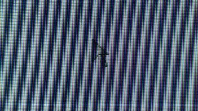 Pixel on old vintage computer monitor close-up. Computers cursor macro. Desktop vintage retro wave display, late 90s PC.