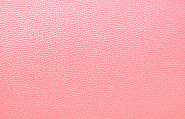 Pink glossy pebbled leather pattern as texture or background