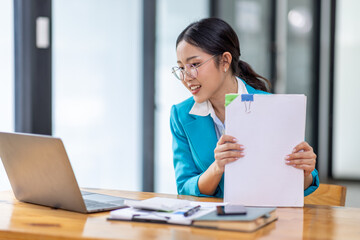 Business Documents, Auditor businesswoman checking searching document legal prepare paperwork or report for analysis TAX time,accountant Documents data contract partner deal in workplace office
