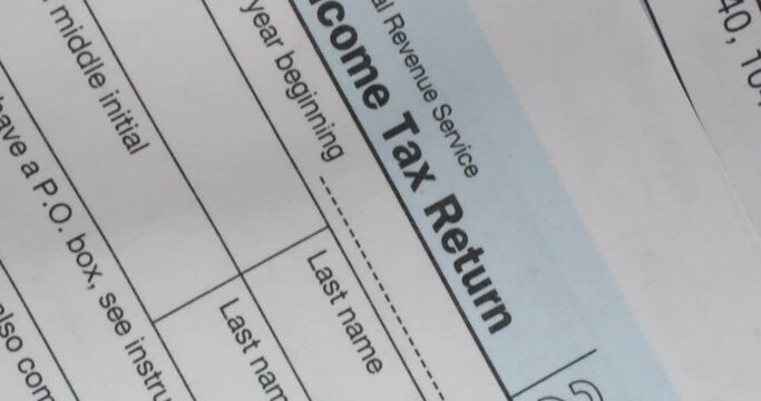 Pan of United States 1040 individual income tax form. Closeup pan high quality 4k