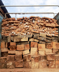 Selective focus. Wooden blocks and boards stacked on pickup car.

