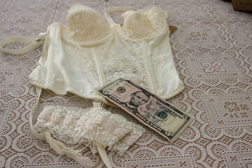 lingerie and dollars on a table