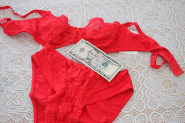 red lingerie and five dollar bill