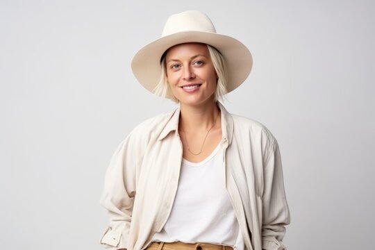 Portrait of a beautiful woman in hat smiling and looking at camera