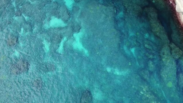 Aerial video of a rocky cliff at Auth Beach. The beautiful nature of Nusa Penida in Bali, Indonesia.