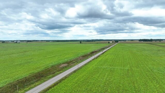 Aerial Flyover of Tranquil Indiana Farmland and Country Road
