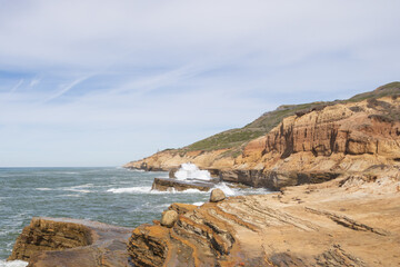 Waves breaking on cliffs, San Diego, California