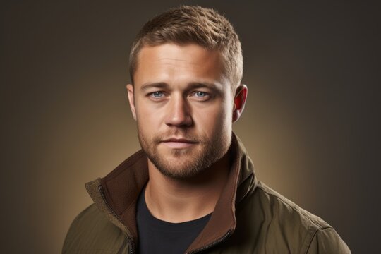 Portrait of a handsome young man over dark background. Men's beauty, fashion.