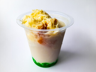 Durian Cendol Ice Drink topped with grated cheese and slices of bread