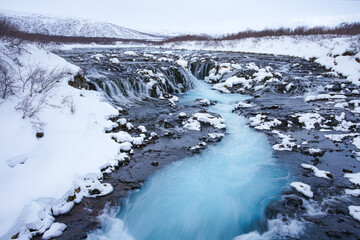 Bruarfoss waterfall in winter, a stand-out and a popular destination among travelers in the Southwest of Iceland. 
