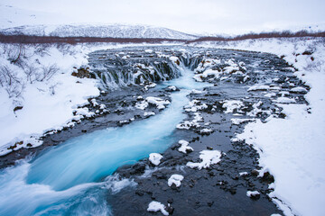 Bruarfoss waterfall in winter, a stand-out and a popular destination among travelers in the Southwest of Iceland. 
