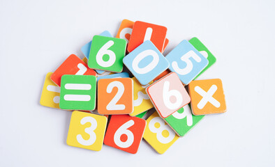 Number wood block cubes for learning Mathematic, education math concept.