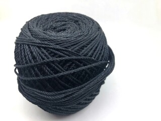 black knitting thread isolated on white