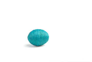 Easter egg made of thread, isolated on white background.