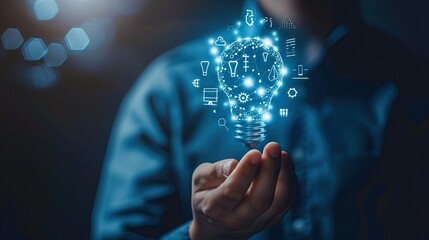 Business strategic planning ideas for investment and business growth Businessman uses his hand to support a glowing blue light bulb with futuristic graphic technology icons.