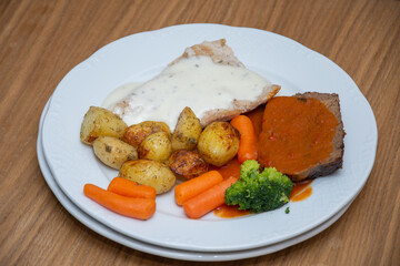 Pork steak with carrots and broccoli