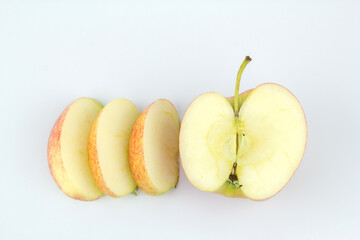 Whole red apple fruit with slice (cut) isolated on white background.