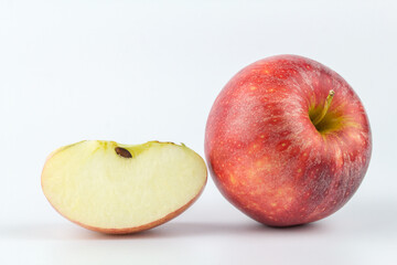 Naklejka na ściany i meble Whole red apple fruit with slice (cut) isolated on white background.