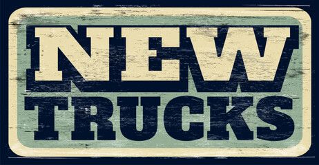 Aged and worn new trucks sign on wood