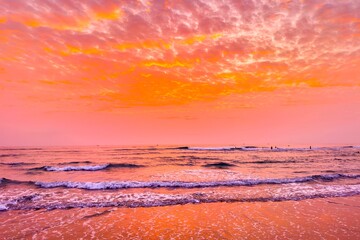 Sunrise sea sand beach in Danang,Vietnam.Inspire tropical beach seascape horizon. Orange and golden sunset sky calmness tranquil relaxing sunlight summer mood. Vacation travel holiday banner.
