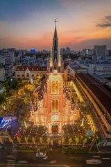 Foto op Plexiglas December 16, 2023: panoramic view of Tan Dinh church in Ho Chi Minh City, Vietnam during sunset © Long