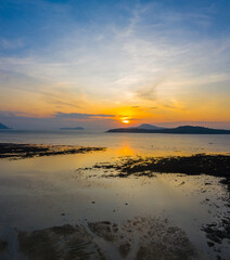 Fototapeta premium Aerial view colorful cloud at sunrise above the ocean. .Majestic sunset or sunrise landscape Amazing light of nature amazing cloud scape sky and colorful clouds moving away rolling.