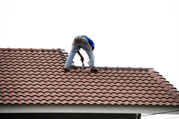 worker on the roof of a house
