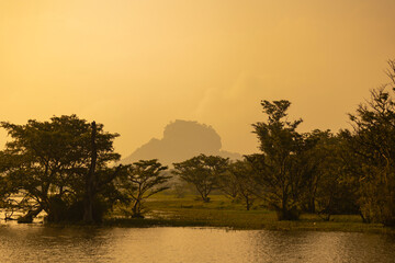 Misty early morning views of Sigiriya rock in Dambulla in the Central Province, Sri Lanka